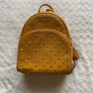Michael Kors Mini Backpack in Mustard